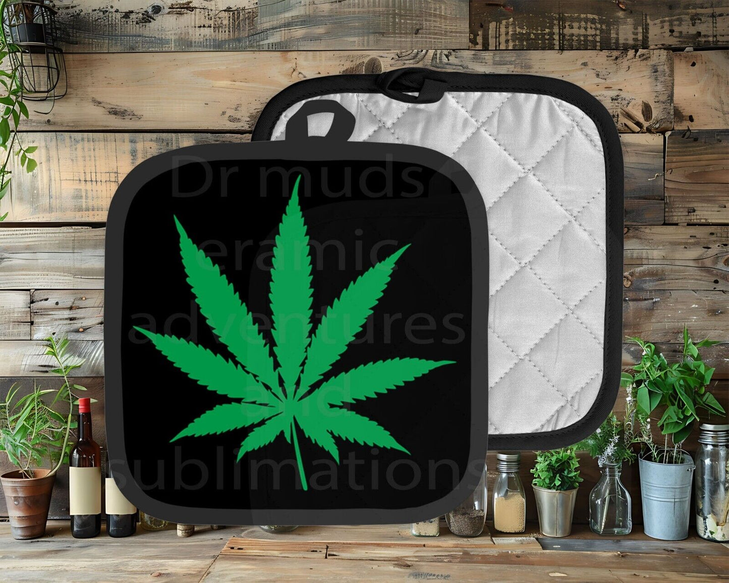 420 DA WEED pot holder with green leaf design on black polyester front.