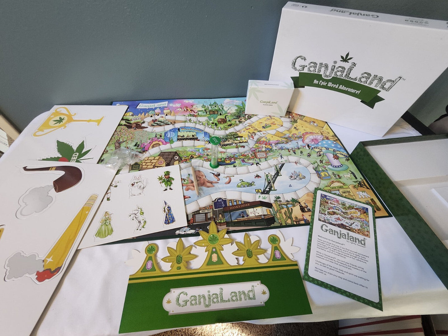 GanjaLand An Epic Weed Adventure board game setup with game pieces and colorful board.