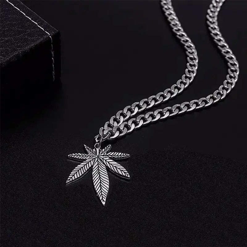 Silvery cannabis leaf pendant necklace with chain.