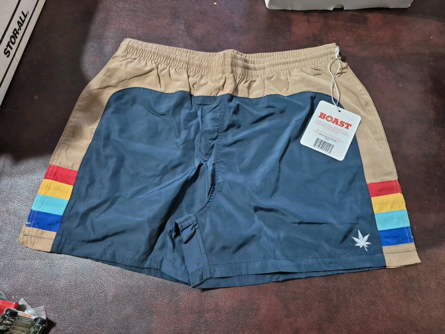 BOAST men's tennis/swim trunks large camel/navy with pot leaf design.