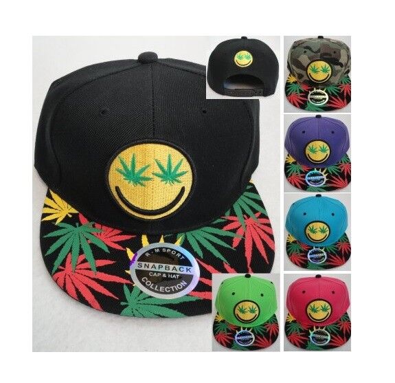Smiley face marijuana leaf eyes emoji on snapback hat with colorful weed leaves on bill.