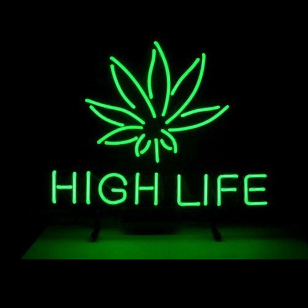 Marijuana hemp leaf neon sign with "High Life" text, green glow, glass tube.