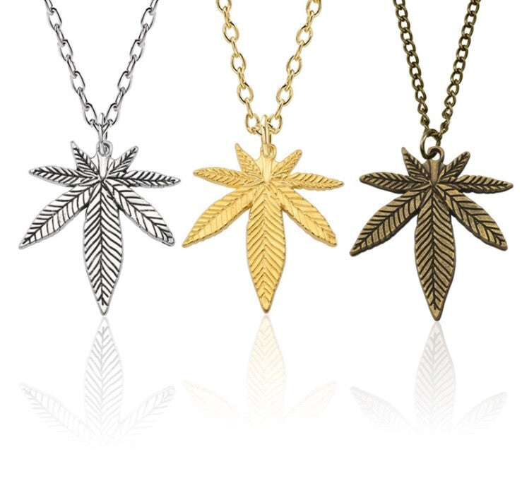 Weed cannabis maple leaf necklace in silver, gold, and bronze plating.