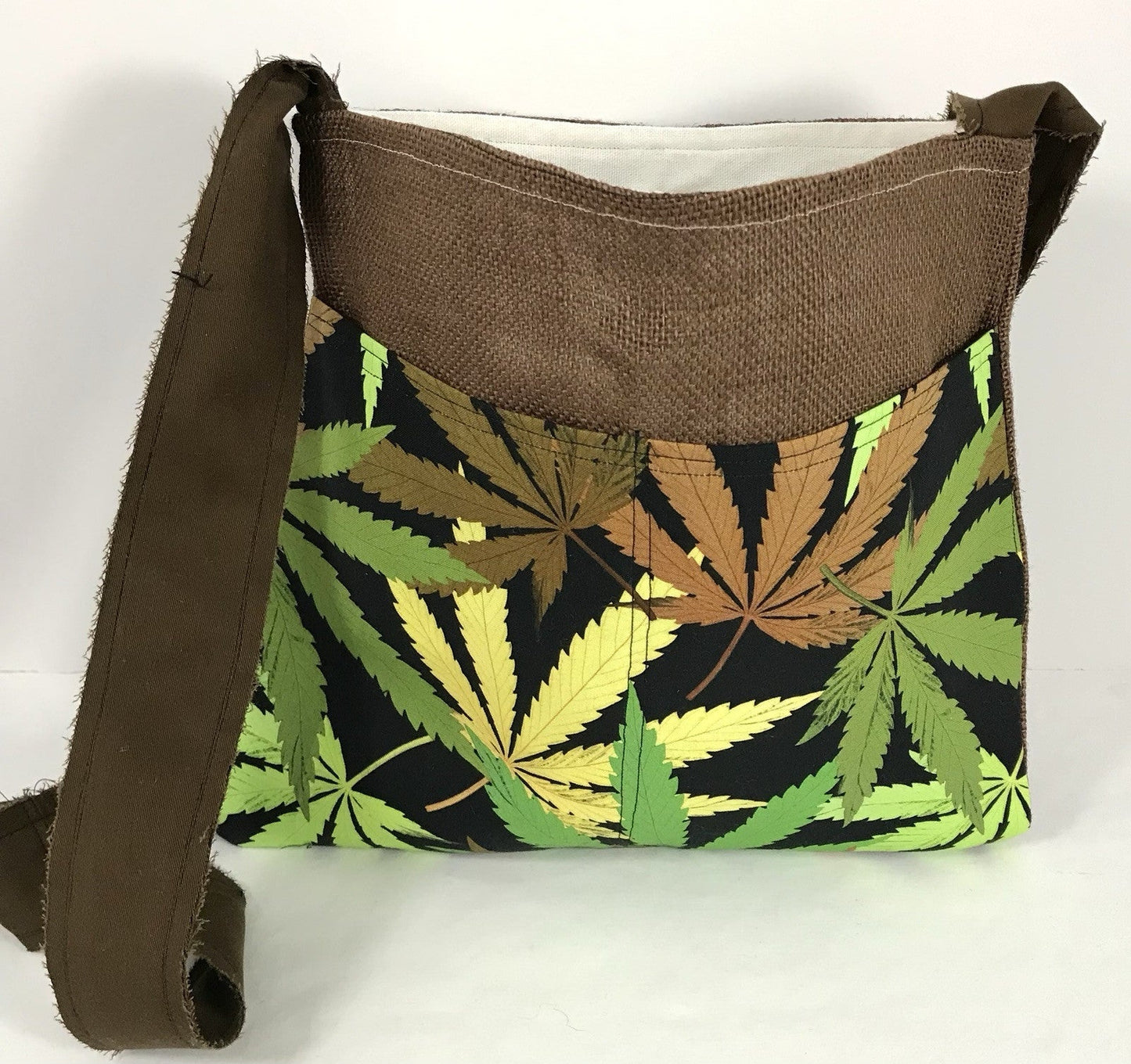Handmade burlap marijuana leaf crossbody bag with bumblebee pockets.