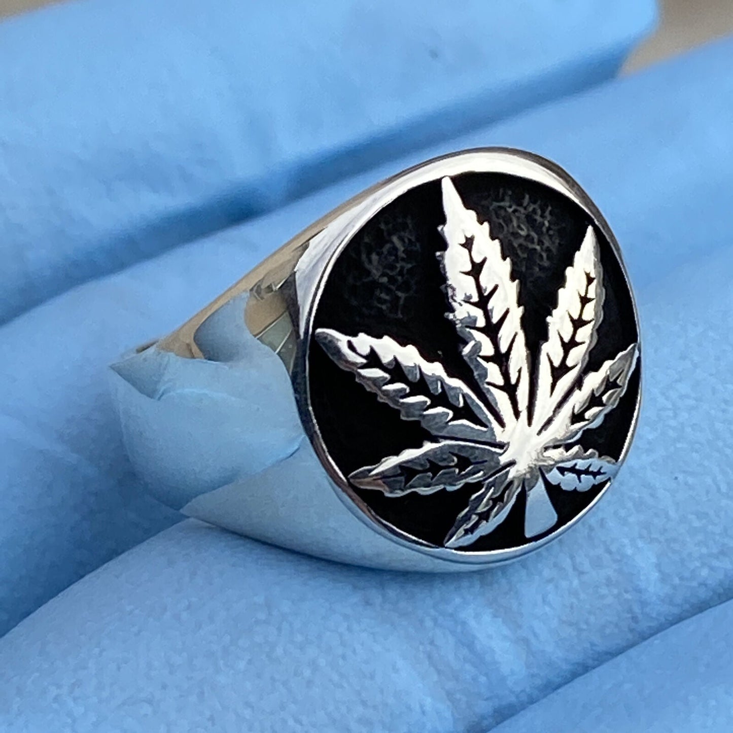 Mens 925 sterling silver weed ring with black oxidized pot leaf design.