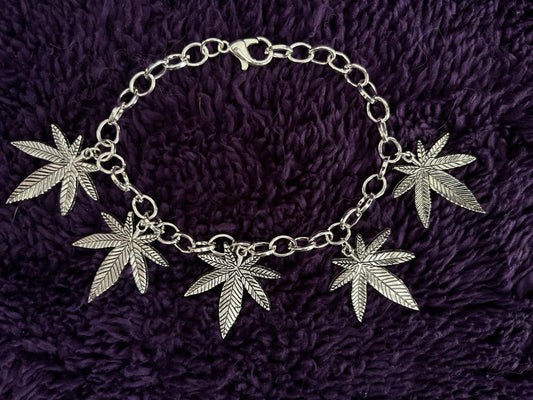 Pot leaf charm bracelet with five leaf charms on an adjustable chain.