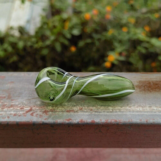 3.1" green spoon shape hand pipe made of borosilicate glass.