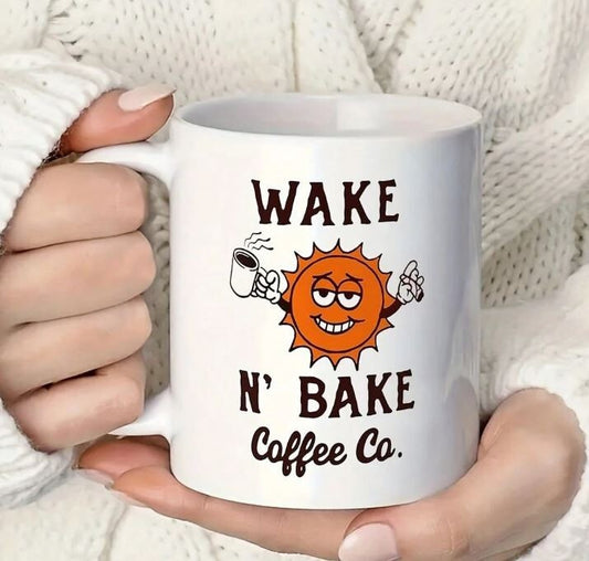 Wake N Bake Coffee Co Mug with cartoon sun design and ergonomic handle.