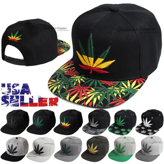 Adjustable black snapback baseball cap with marijuana leaf embroidery design on brim and front.