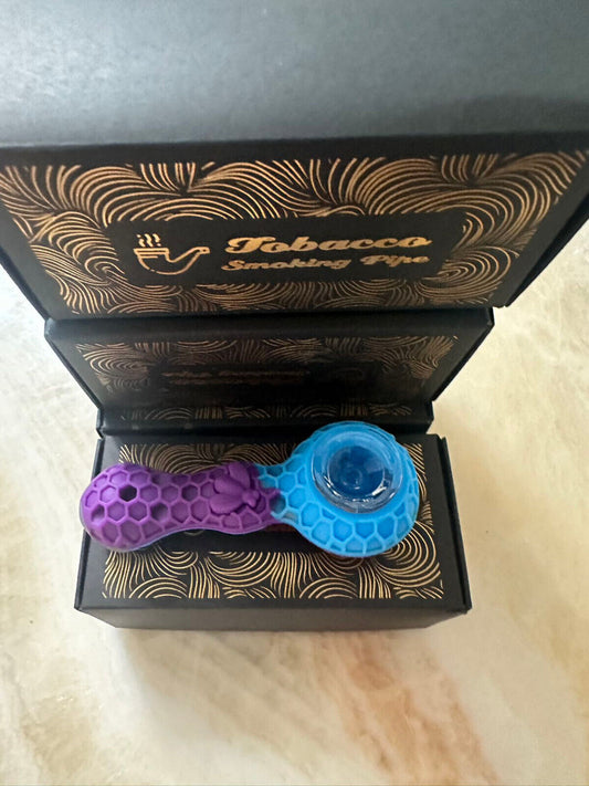 Purple silicone smoking pipe with textured design in black gift box.