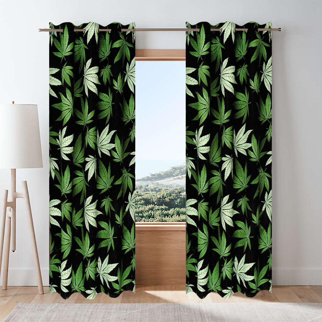 Blackout grommet window curtain set with black and green marijuana leaf design.