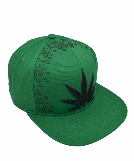 Green snapback cap with black cannabis leaf design, featuring stylish patterns, perfect for weed enthusiasts.