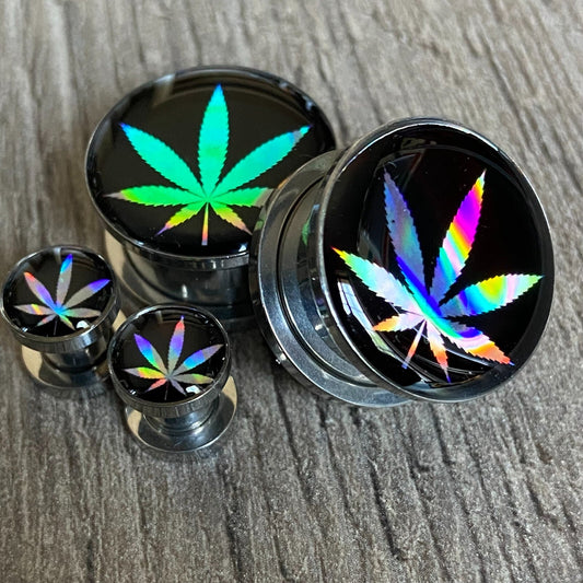 Pair of screw-on holographic pot leaf picture plugs in various sizes, made from stainless steel and resin.