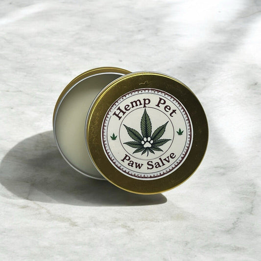 Natural Hemp Pet Salve in tin for paw care and pain relief.