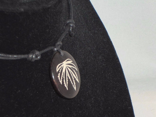 Brown pot leaf necklace with adjustable length, featuring a resin pendant design.