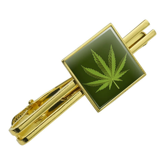 Gold tie bar clip with marijuana leaf design, cannabis-themed accessory.