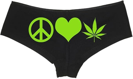 Black boyshort panties with peace, love, and marijuana leaf symbols in green.